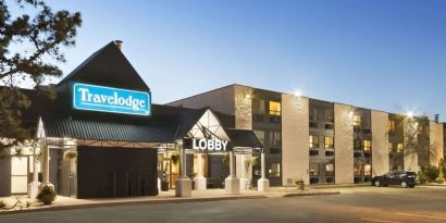 Hotel exterior and parking area at Travelodge Edmonton South.