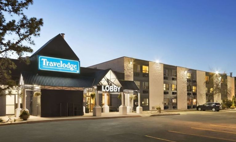 Hotel exterior and parking area at Travelodge Edmonton South.