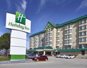 Hotel exterior and parking area at Holiday Inn Conference Center Edmonton South.