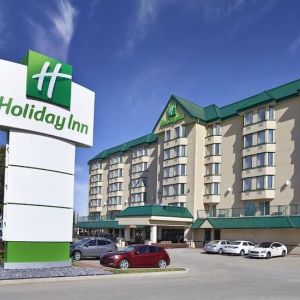 Hotel exterior and parking area at Holiday Inn Conference Center Edmonton South.