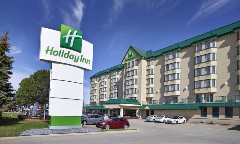 Hotel exterior and parking area at Holiday Inn Conference Center Edmonton South.