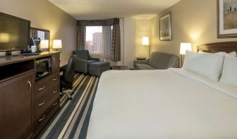 Day use room with work desk and living area at Holiday Inn Conference Center Edmonton South.