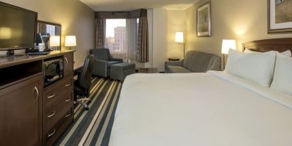 Day use room with work desk and living area at Holiday Inn Conference Center Edmonton South.