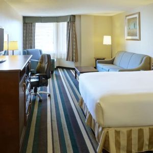 Bright day use room with living area and workspace at Holiday Inn Conference Center Edmonton South.