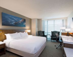 Day use room with TV, work desk and sofas at Delta St. John's Hotel & Conference Center.