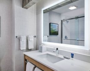 Guest bathroom with shower at Four Points By Sheraton Salt Lake City Airport.