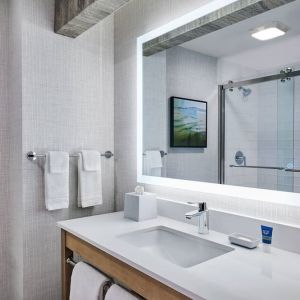 Guest bathroom with shower at Four Points By Sheraton Salt Lake City Airport.