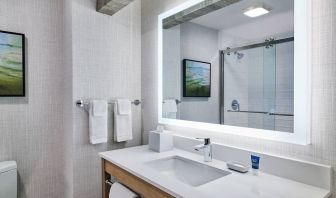 Guest bathroom with shower at Four Points By Sheraton Salt Lake City Airport.