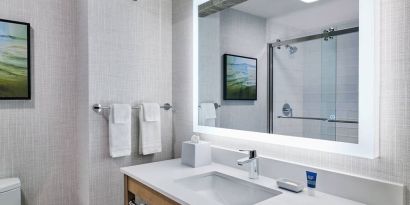 Guest bathroom with shower at Four Points By Sheraton Salt Lake City Airport.