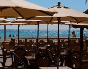 Dining area with ocean view at Riptide Hotel.