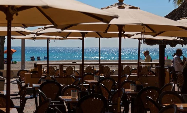 Dining area with ocean view at Riptide Hotel.