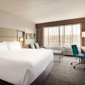 Day use room with work desk and sofa at Crowne Plaza Englewood.