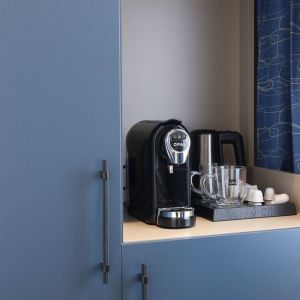 Day room with coffee station at Spark By Hilton Luton.