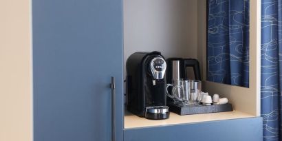 Day room with coffee station at Spark By Hilton Luton.