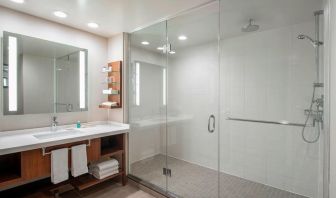 Guest bathroom with shower and free toiletries at Delta Hotel By Marriott Regina.