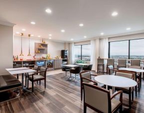 Dining area with comfortable seating at Delta Hotel By Marriott Regina.