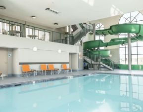 Indoor pool with water slide at Holiday Inn Express & Suites Medicine Hat.