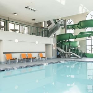 Indoor pool with water slide at Holiday Inn Express & Suites Medicine Hat.