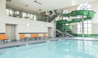 Indoor pool with water slide at Holiday Inn Express & Suites Medicine Hat.