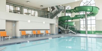 Indoor pool with water slide at Holiday Inn Express & Suites Medicine Hat.