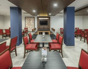 Dining area with comfortable seating at Holiday Inn Express & Suites Medicine Hat.