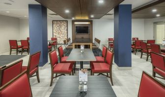 Dining area with comfortable seating at Holiday Inn Express & Suites Medicine Hat.