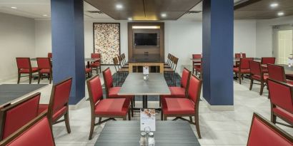 Dining area with comfortable seating at Holiday Inn Express & Suites Medicine Hat.