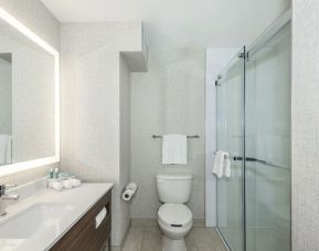 Guest bathroom with shower and free toiletries at Holiday Inn Express & Suites Medicine Hat.