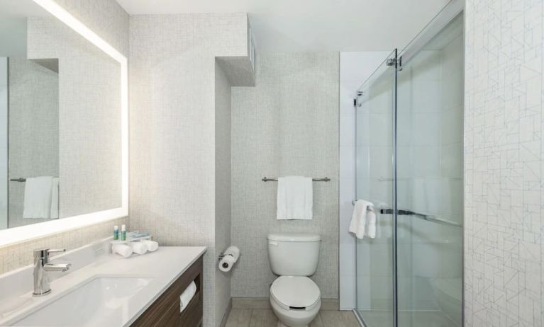 Guest bathroom with shower and free toiletries at Holiday Inn Express & Suites Medicine Hat.