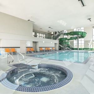 Indoor pool, jacuzzi and water slide at Holiday Inn Express & Suites Medicine Hat.