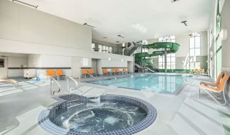 Indoor pool, jacuzzi and water slide at Holiday Inn Express & Suites Medicine Hat.