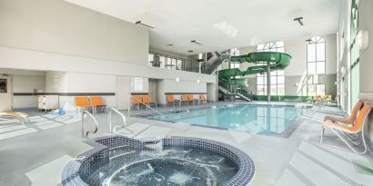 Indoor pool, jacuzzi and water slide at Holiday Inn Express & Suites Medicine Hat.