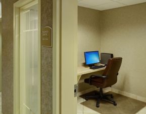 Business center with computer, printer and ergonomic chair at Holiday Inn Express & Suites Medicine Hat.