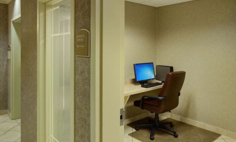 Business center with computer, printer and ergonomic chair at Holiday Inn Express & Suites Medicine Hat.