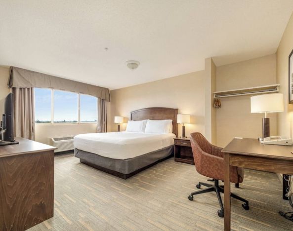 Bright and spacious day use room with work desk at Holiday Inn Lethbridge. 