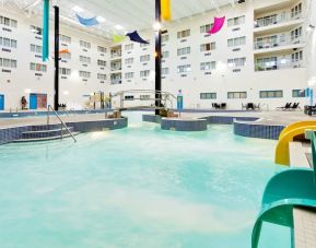 Indoor pool with water slides at Holiday Inn Lethbridge. 