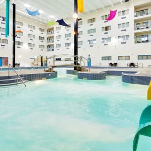 Indoor pool with water slides at Holiday Inn Lethbridge. 