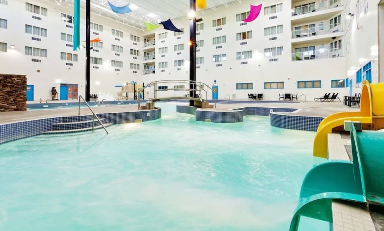 Indoor pool with water slides at Holiday Inn Lethbridge. 