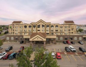 Hotel exterior with parking area at Holiday Inn Lethbridge. 