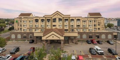 Hotel exterior with parking area at Holiday Inn Lethbridge. 