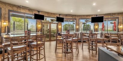 Hotel bar and lounge area at Holiday Inn Lethbridge. 