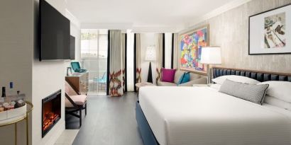 Day use room with balcony and sofa at Le Parc At Melrose.