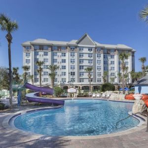 Refreshing outdoor pool with slide at Holiday Inn Express & Suites S Lake Buena Vista.