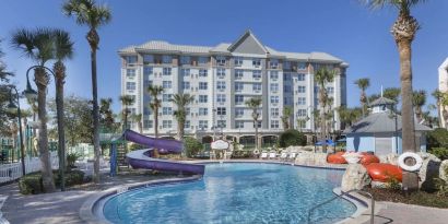 Refreshing outdoor pool with slide at Holiday Inn Express & Suites S Lake Buena Vista.