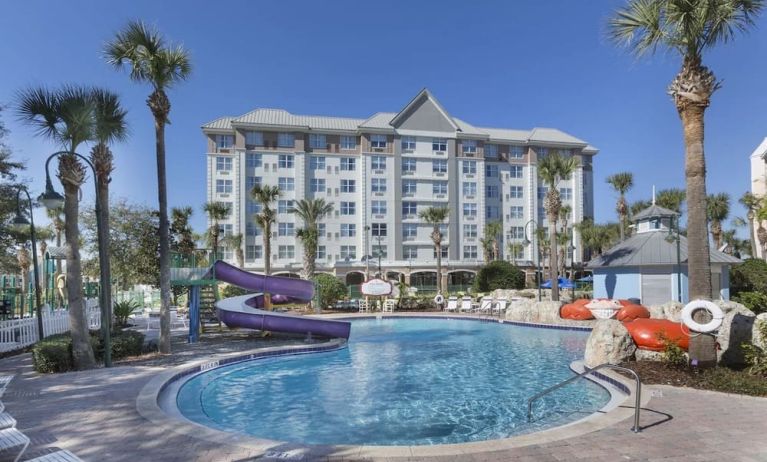 Refreshing outdoor pool with slide at Holiday Inn Express & Suites S Lake Buena Vista.