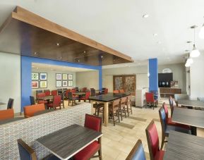 Dining area perfect for coworking at Holiday Inn Express & Suites S Lake Buena Vista.