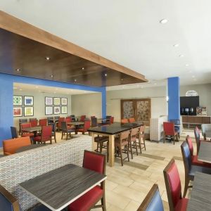 Dining area perfect for coworking at Holiday Inn Express & Suites S Lake Buena Vista.