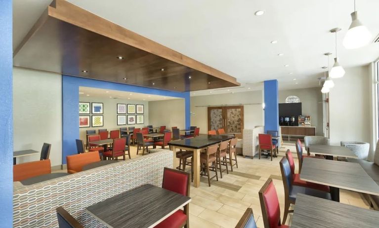 Dining area perfect for coworking at Holiday Inn Express & Suites S Lake Buena Vista.