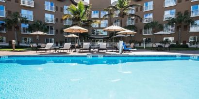 Refreshing outdoor pool at Holiday Inn Express & Suites Naples Downtown - 5th Avenue.