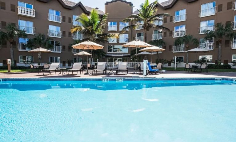 Refreshing outdoor pool at Holiday Inn Express & Suites Naples Downtown - 5th Avenue.